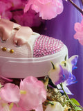 Pink gemstones decorating toe top shoes