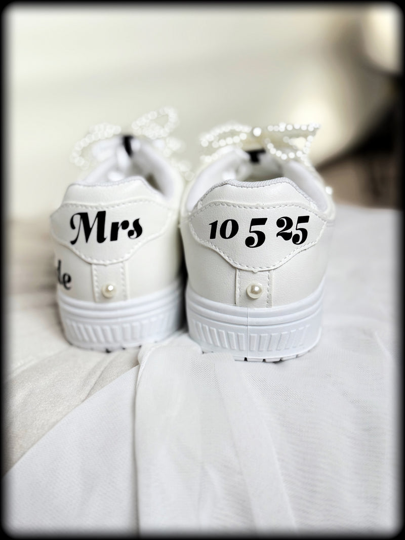 White Comfy-Stylish Personalized Bride Sneakers, customized with Pearl Bow Shoe Charms Clips with Satin Lux Laces and Permanent Vinyl